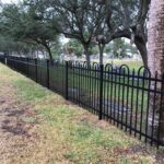 aluminum fence in black with arched top accents