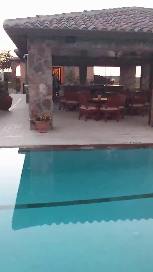 preview image of video tour featuring community clubhouse by pool and spa