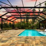built in pool with wading deck and screen enclosure