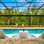 built in pool with wading deck and screen enclosure