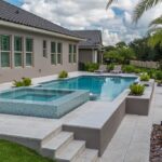 luxury pool with wading deck and whirlpool spa
