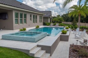 luxury pool with wading deck and whirlpool spa