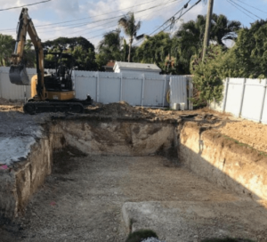 excavaction to dig area for pool using large crane machine