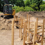 free form pool dig frame with wood posts